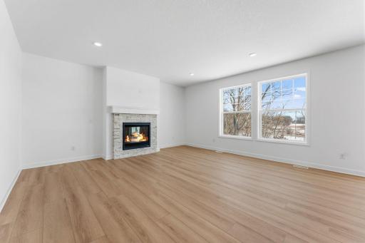 The Great Room features large windows for ample natural light and is the perfect place for gathering with friends and family.