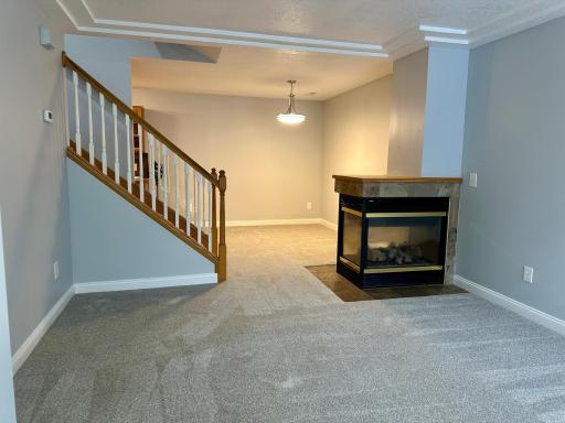 Cozy! Peninsula Fireplace on the Main Level.