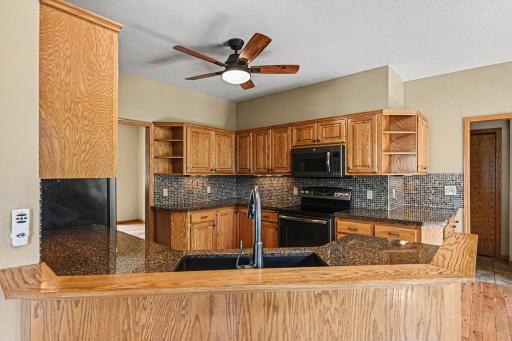 Perfect for hosting and daily living! This open-concept layout keeps the kitchen fully connected to both the living room and informal dining room, ensuring you're always part of the conversation while prepping meals.