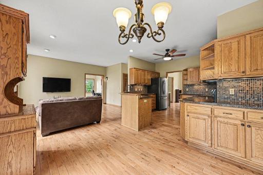 A perfect perspective of the open-concept design! This view from the patio door highlights the seamless connection between the informal dining area, kitchen, and living room, ideal for entertaining and daily life.
