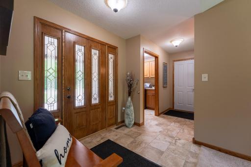 The main level laundry room is conveniently located between the front door & garage entrance.
