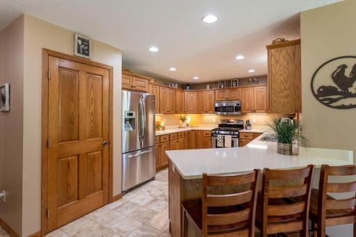 Designed for comfortable main-level living, the thoughtfully planned floorplan features a spacious kitchen with newer granite countertops, abundant cabinetry, and an adjoining dining area overlooking the picturesque backyard.