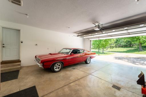 Car enthusiasts, hobbyists, and anyone needingÂ functionalÂ workspace will appreciate the oversized insulated and finished two-car garage complete with in-floor heat, humidistat-controlled exhaust fan, and floor drain.