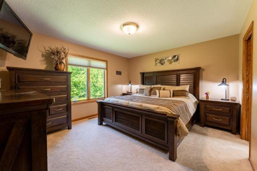 Meticulously maintained and squeaky clean throughout, the main level includes a private primary suite with its own full bathroom