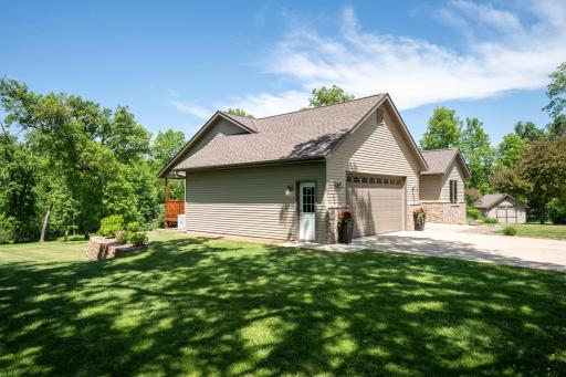 Outside, the easy-maintenance landscaping allows more time to relax and enjoy the scenic surroundings.