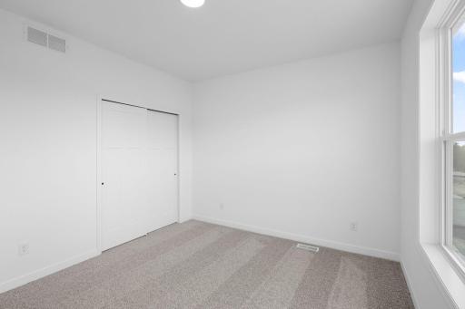 Each bedroom features plush wall-to-wall carpeting