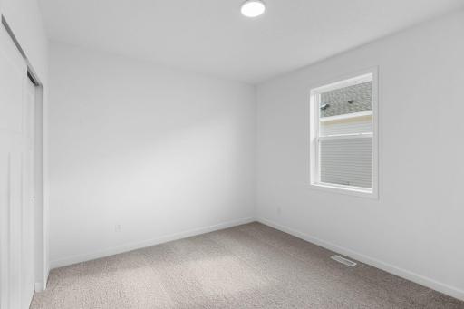 There are two secondary bedrooms down the hall from the ownerâs suite.
