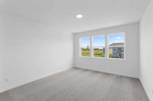 An ownerâs suite sits in a rear corner of the home and is a relaxing oasis with an en-suite bathroom and walk-in closet.