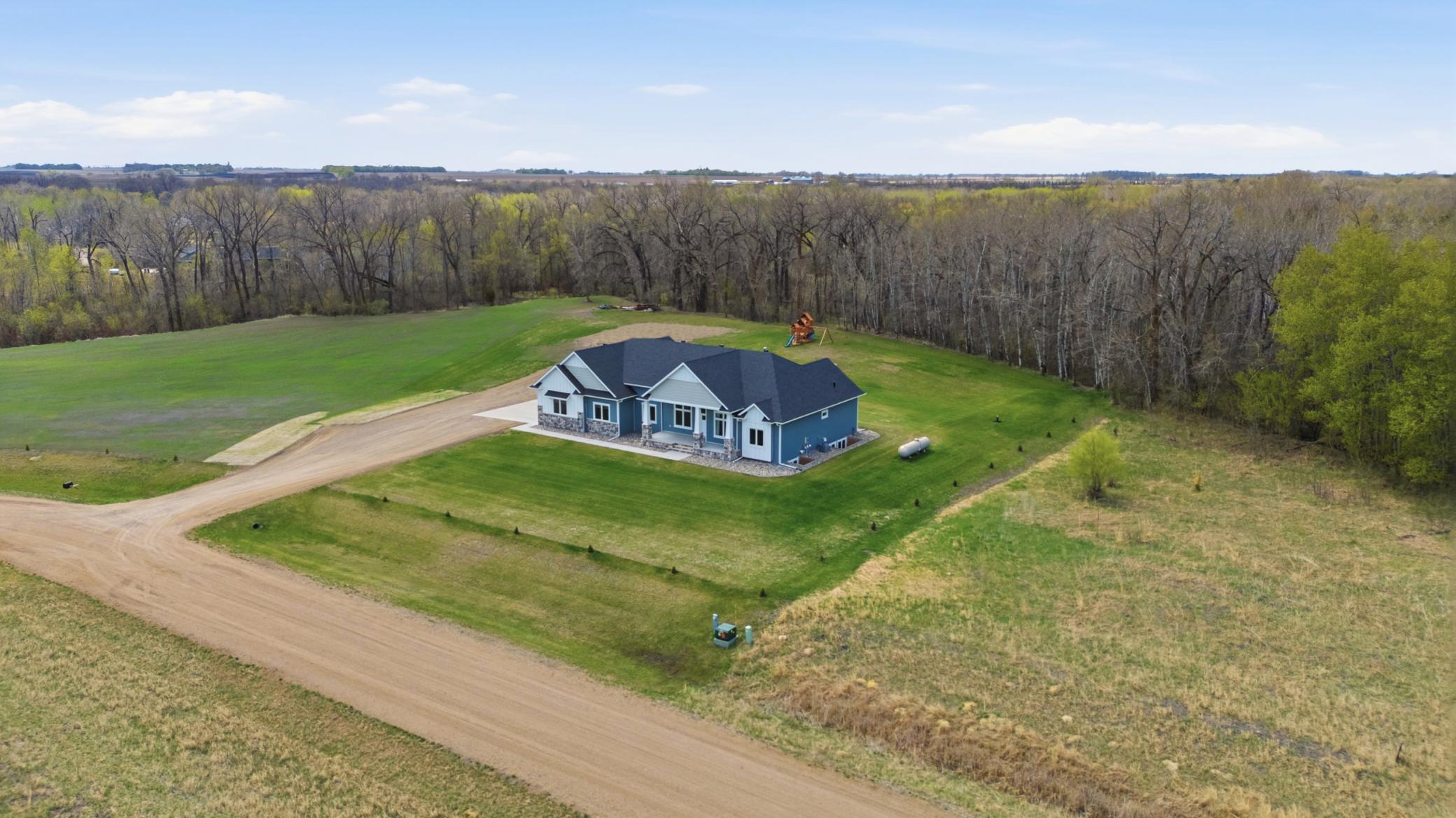 Aerial View - Property continues into the trees.