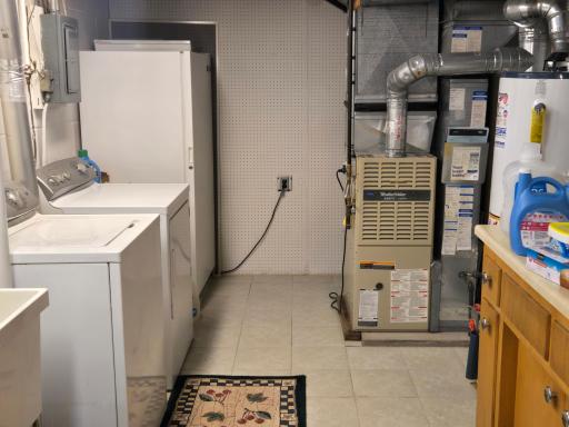 Clean and bright laundry area with workshop or craft counter.