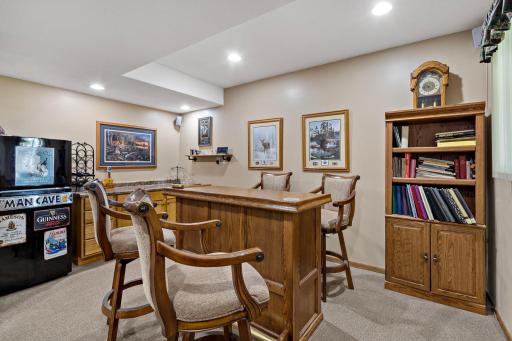 Enjoy hanging out in your "Man Cave" Bar, bar stools & fridge included!