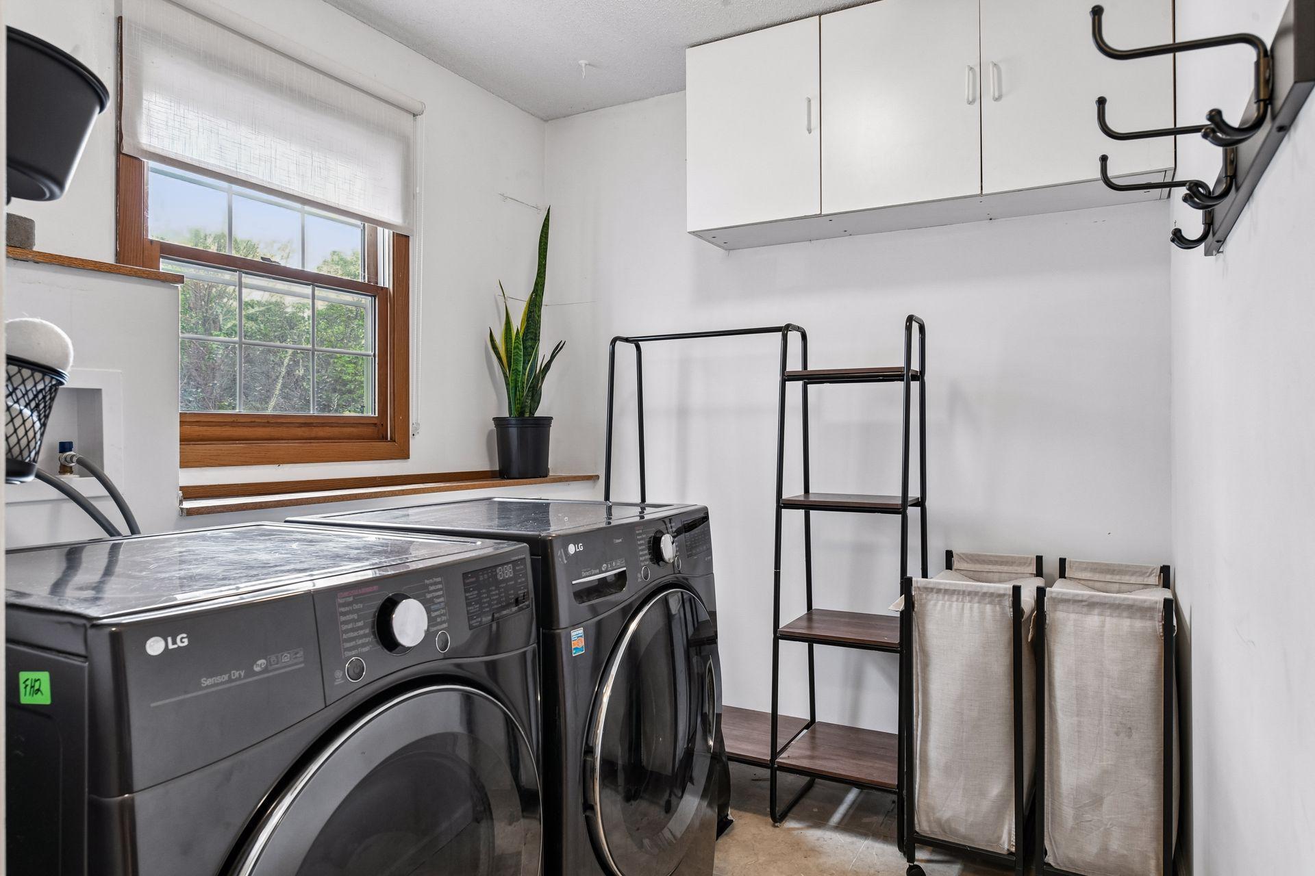 An updated laundry room completes the lower level - enjoy new LG washer and dryer, tiled flooring and cabinetry.