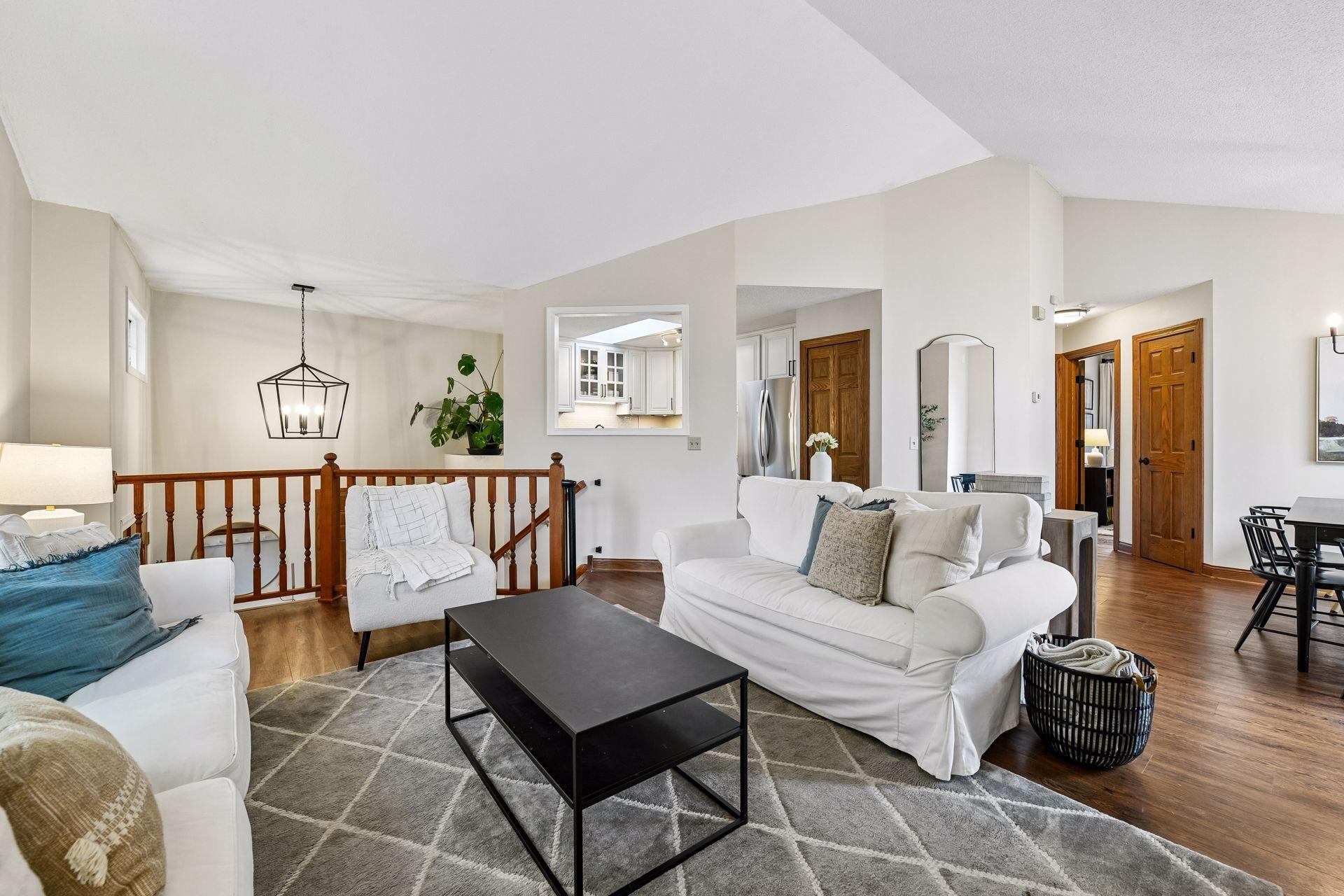 Laminate wood flooring flows throughout the main level.
