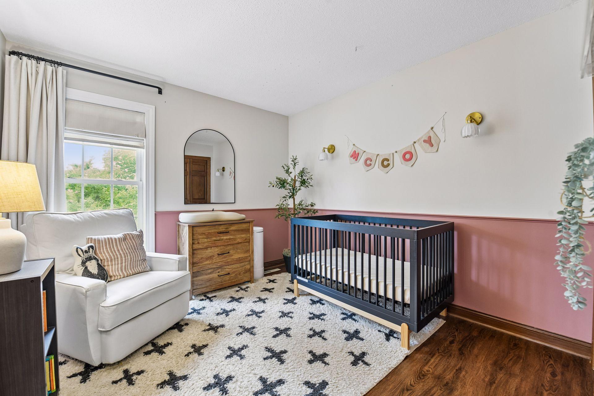 The second bedroom on the main level is currently used as a charming nursery.