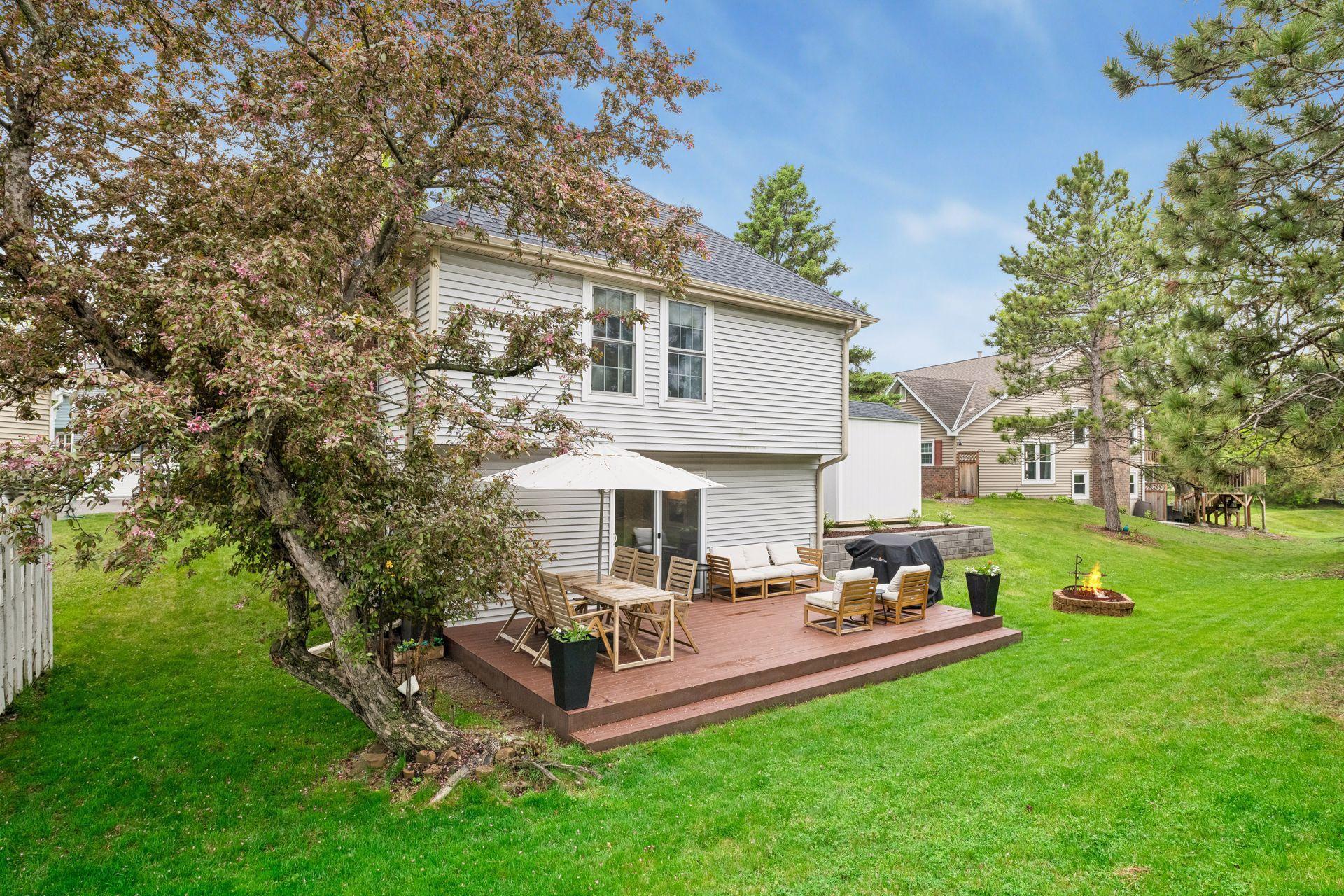 Surrounded by mature trees, the backyard is a private oasis.