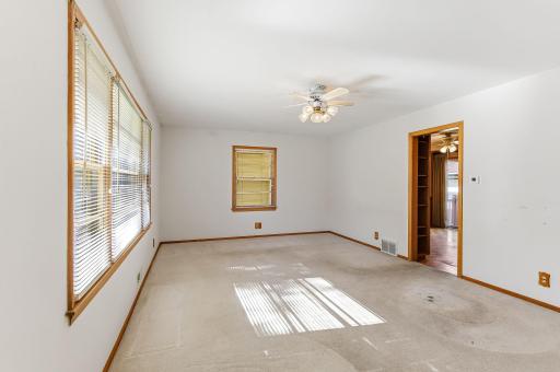 Living room offers easy access to the kitchen, creating a practical layout for everyday living.