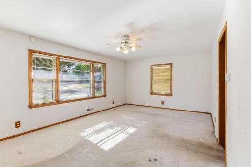 Spacious living room with a large picture window that fills the space with natural light.