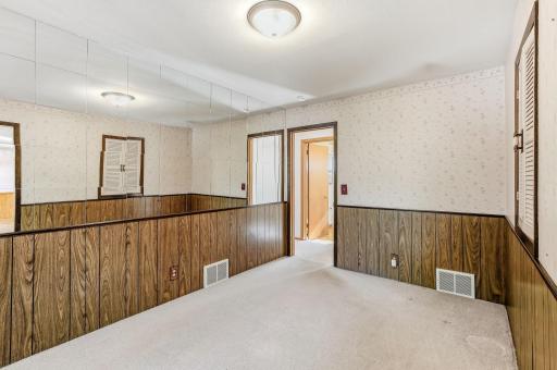 Formal dining room just off the kitchen, offering a practical layout for meals and gatherings.