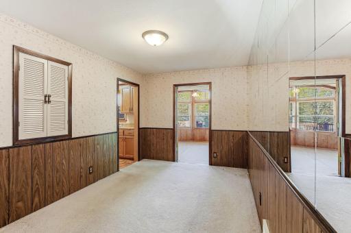 Dining room opens directly into the sunroom, creating a bright extension of the main living space.
