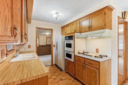 Original kitchen offering solid workspace and excellent potential for modern upgrades and redesign.