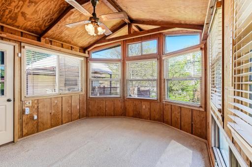 Bright sunroom filled with natural light, offering a relaxing space to unwind.