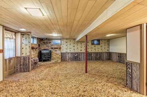 Lower-level family room offers a spacious layout with an opportunity to bring your updates and vision to life.