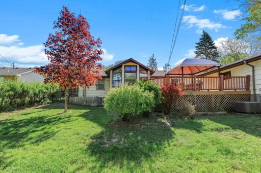 Lush, mature landscaping creates a welcoming setting and a serene outdoor atmosphere.