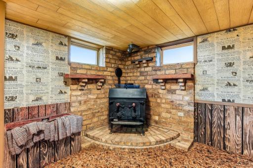 Classic wood-burning stove creates a cozy focal point and enhances the roomâs atmosphere.