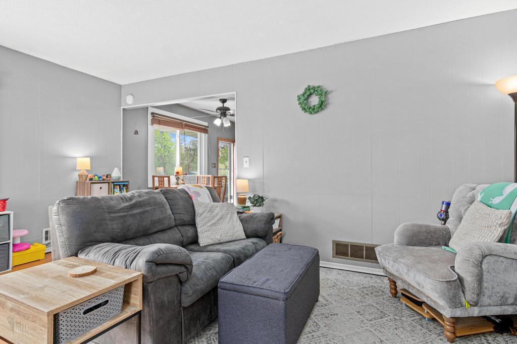 Open, bright main level living room - flows easily into the dinette and the kitchen beyond.