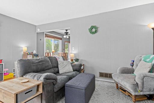 Open, bright main level living room - flows easily into the dinette and the kitchen beyond.