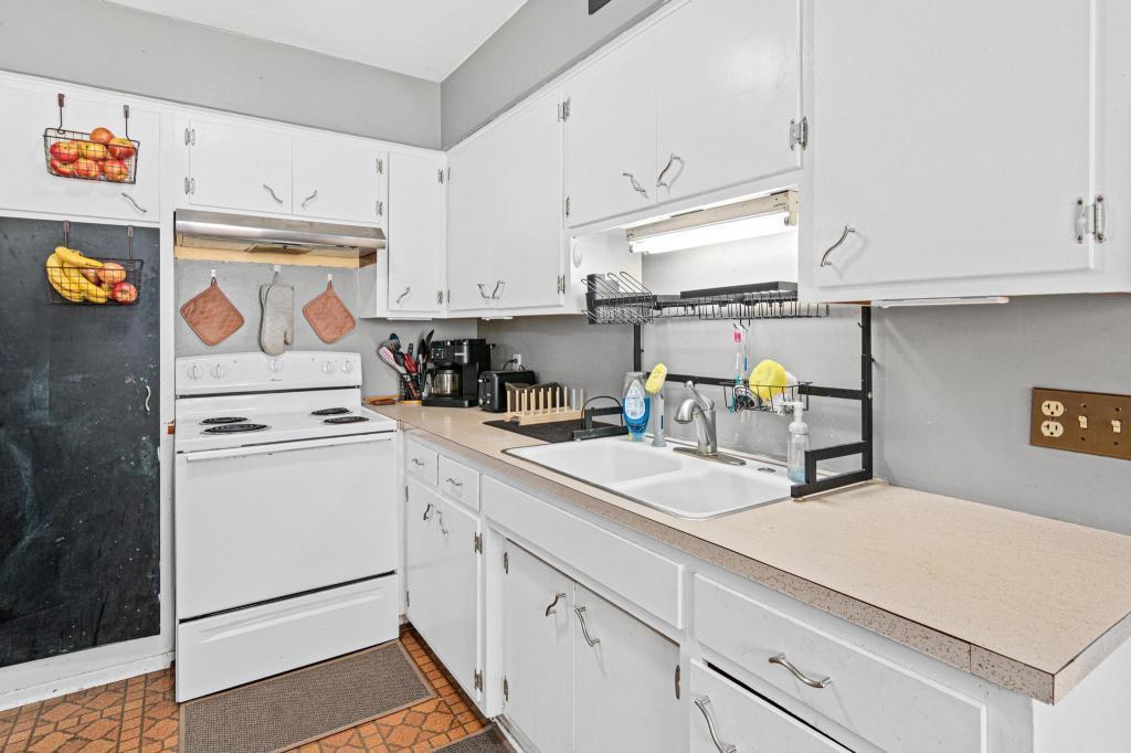 Large kitchen sink and ample counter space make dishes and chores easier.