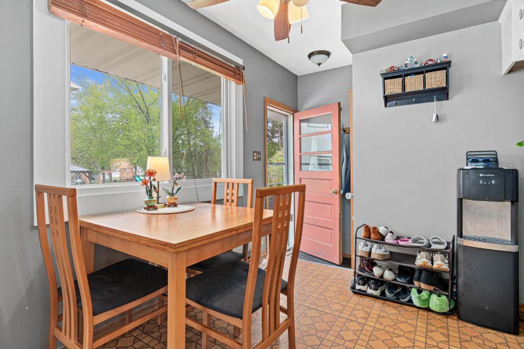 Cozy dinette space perfect for everyday meals and morning coffee. Side door leads to the parking area an backyard beyond.