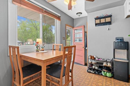 Cozy dinette space perfect for everyday meals and morning coffee. Side door leads to the parking area an backyard beyond.