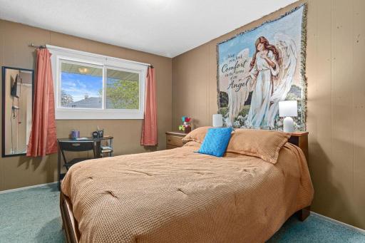 Each unit features two main level bedrooms with comfortable layouts and natural light. Hardwood floors under the carpet throughout the main floor.