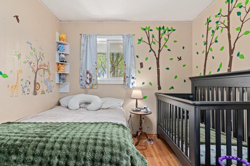 Another view of the second bedroom - overlooking the backyard. Great hardwood floors and newer windows.