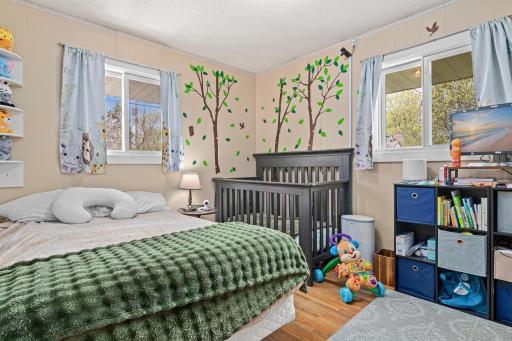 The second of two bedrooms on the main floor - with the hardwood floors exposed.