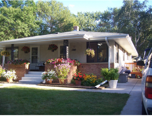 During summer months - beautiful flowers and green grass welcome family and friends.