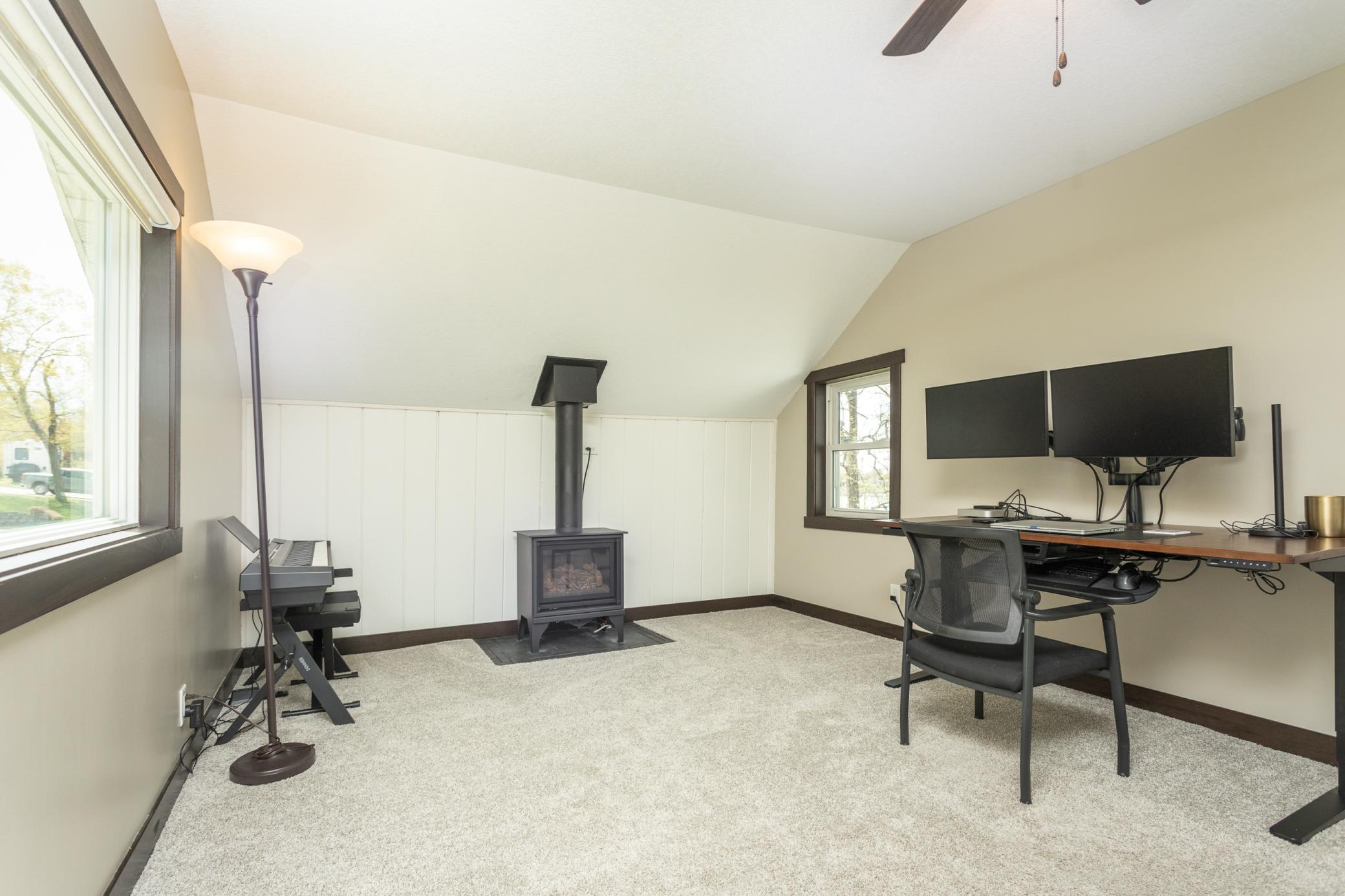 Cozy room off the entry, perfect as a versatile living area or home office
