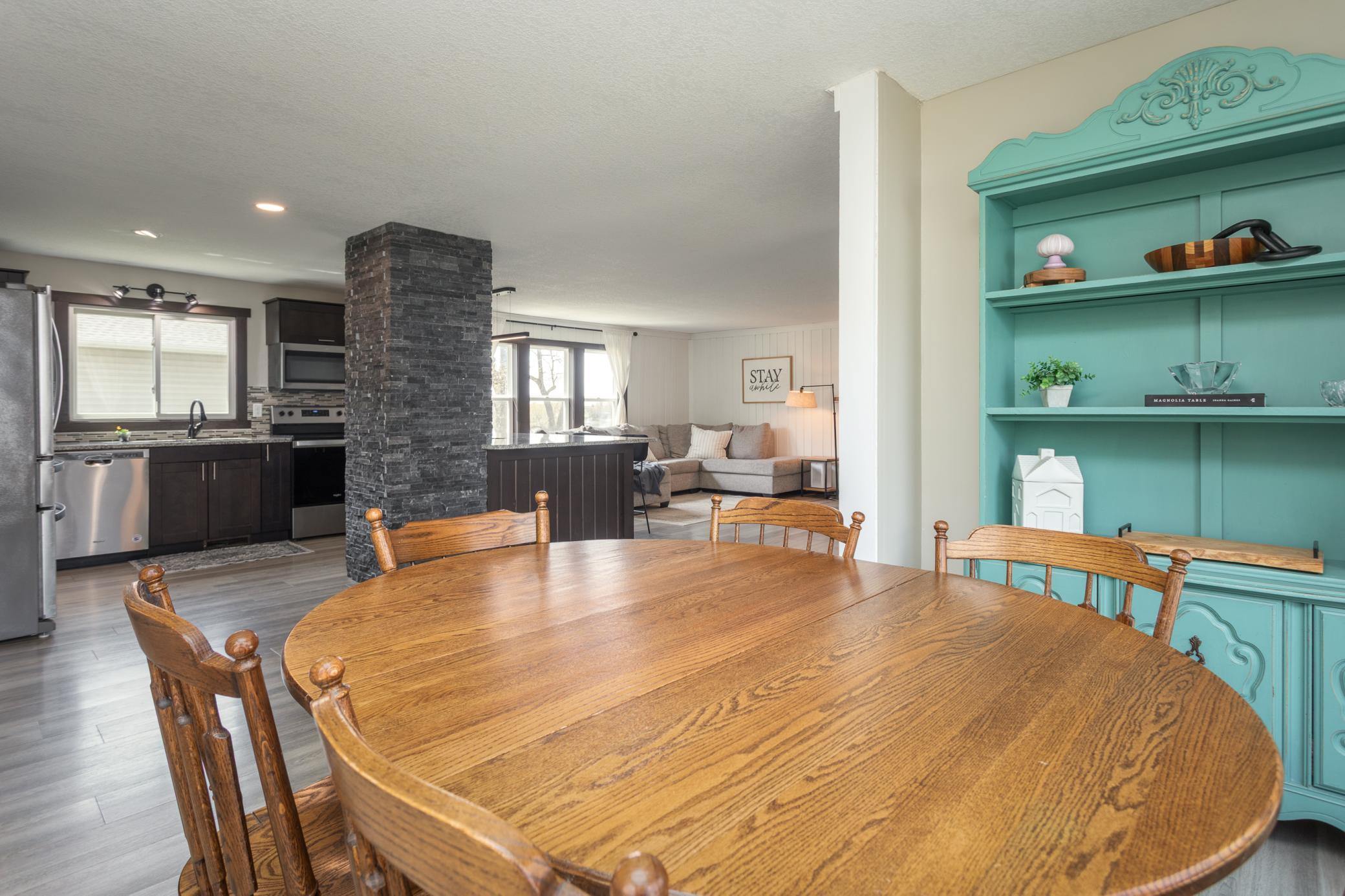 Charming dining room overlooking the kitchen, ideal for family meals