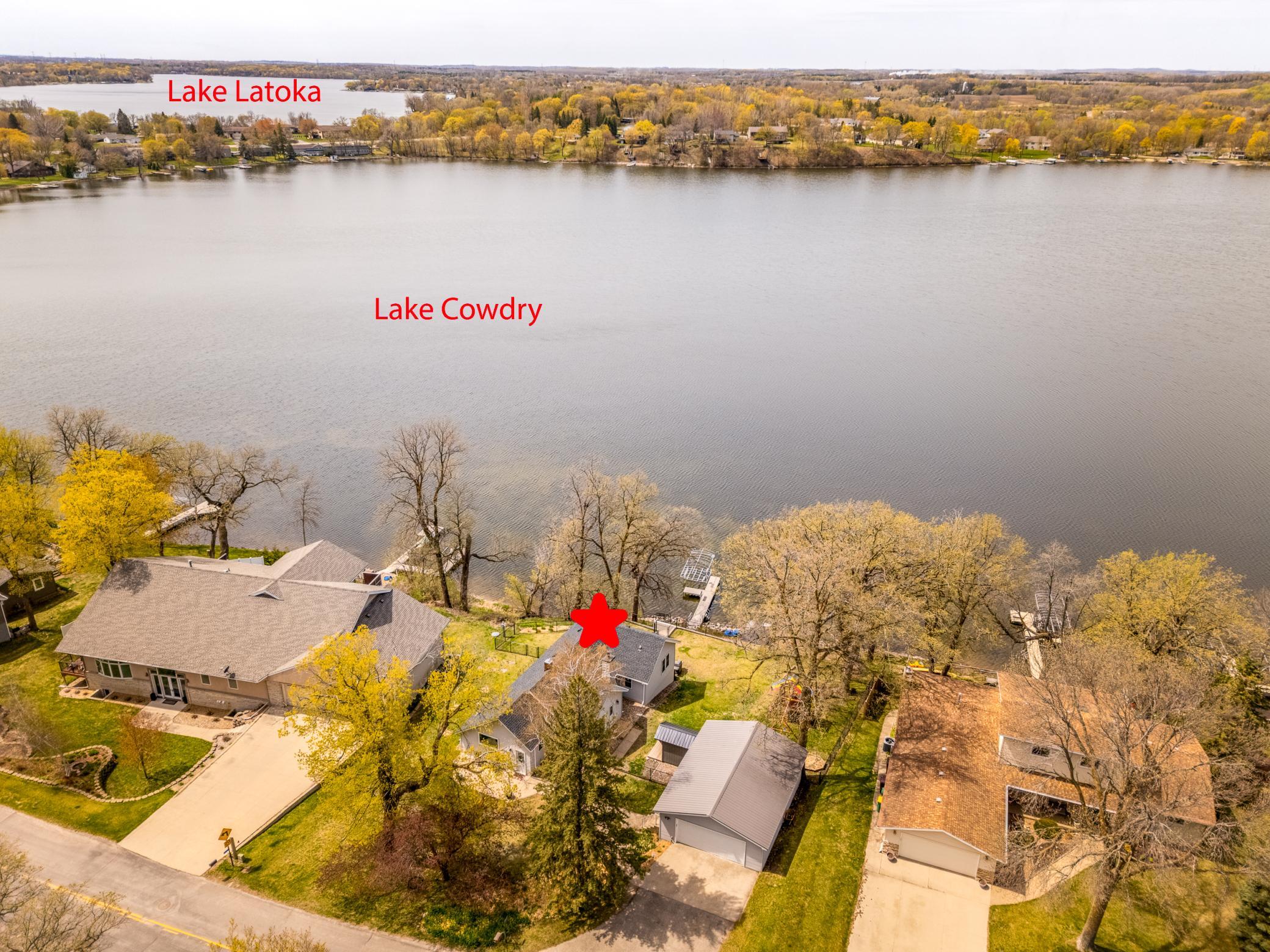 Aerial view highlighting the home’s location to Lake Cowdry
