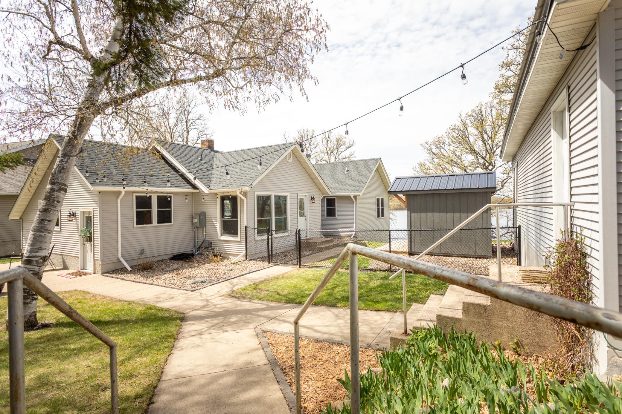 Outdoor walkway linking the home, garage, and sauna for easy access.