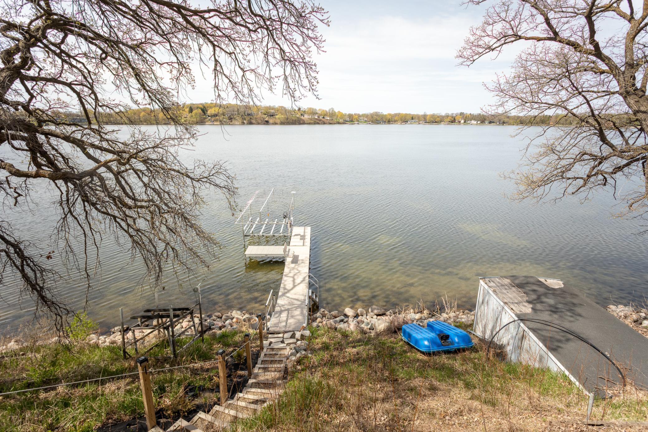 Generous outdoor space off the lower level, ideal for relaxation, entertaining, and enjoying the lake views.
