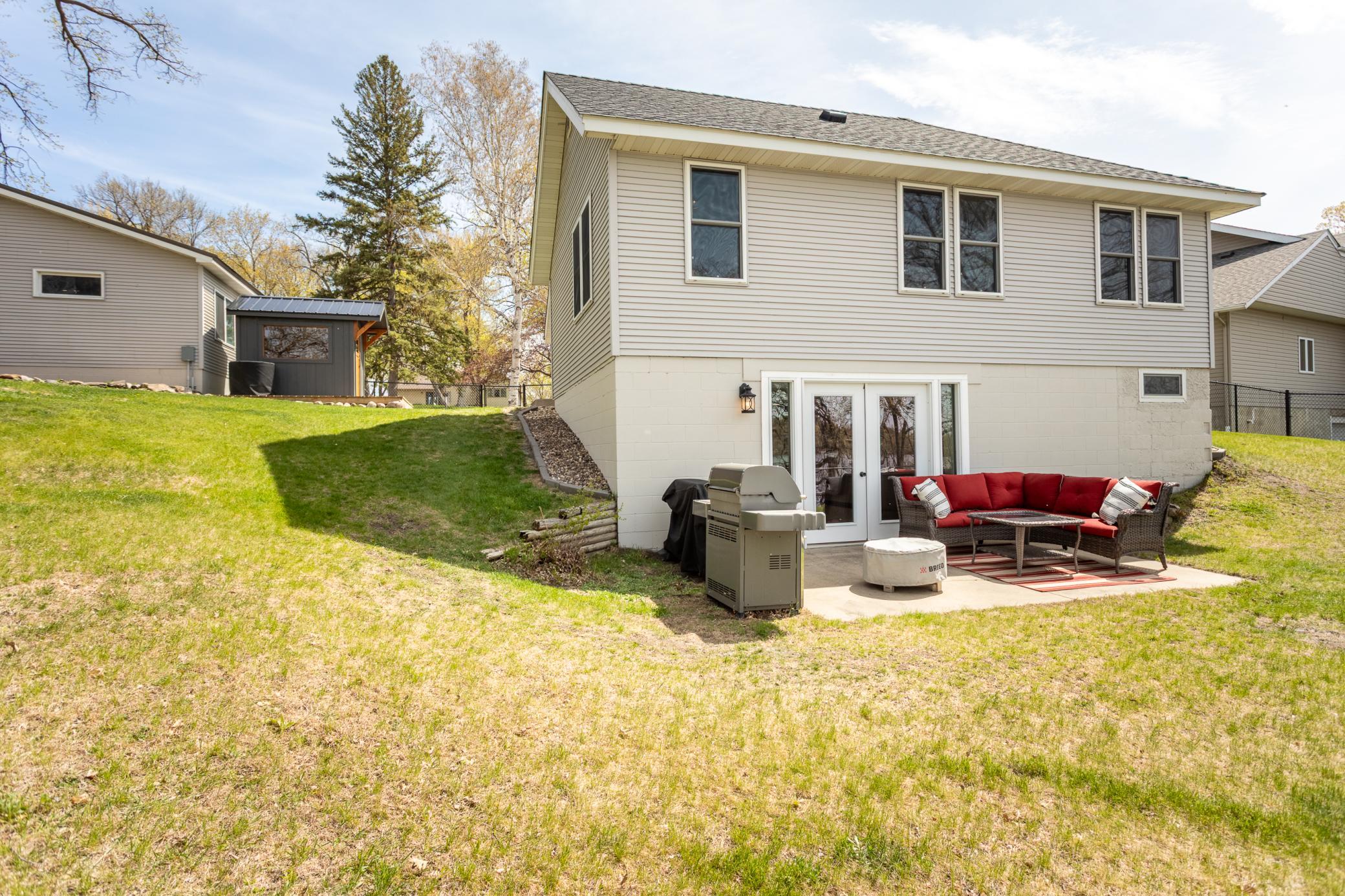 Rear of the house, highlighting the backyard and outdoor amenities.