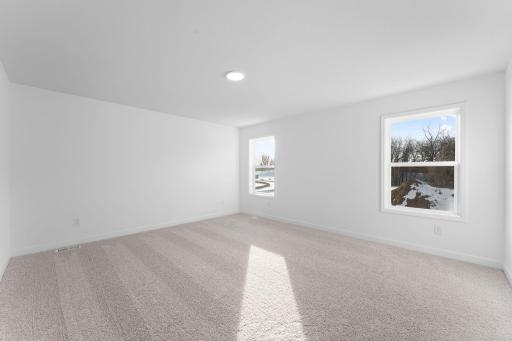 (Photo of a similar home, actual finishes may vary) The ownerâs suite is located on the homeâs second level, complemented by a spa-like bathroom and walk-in closet.