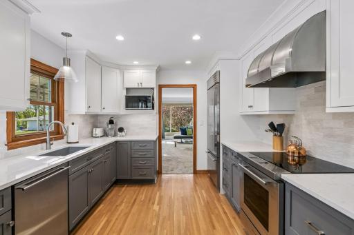 Note the Cambria countertops, Sub Zero refrigerator, and Wolf stove.