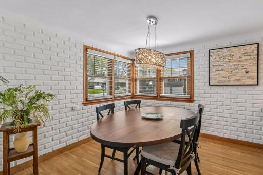 The dining room is a great, light filled space with exposed brick.
