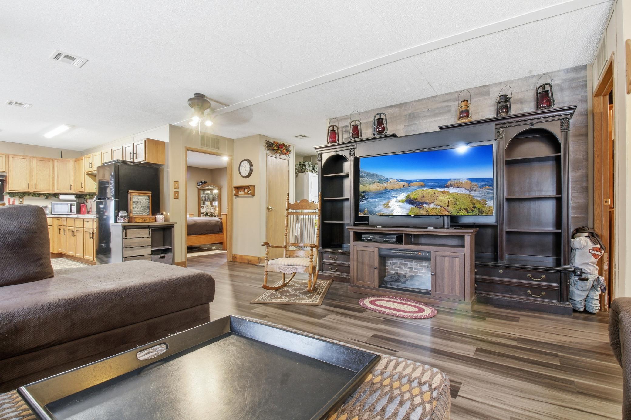 Large living area with durable updated flooring and plenty of space for relaxing or entertaining.