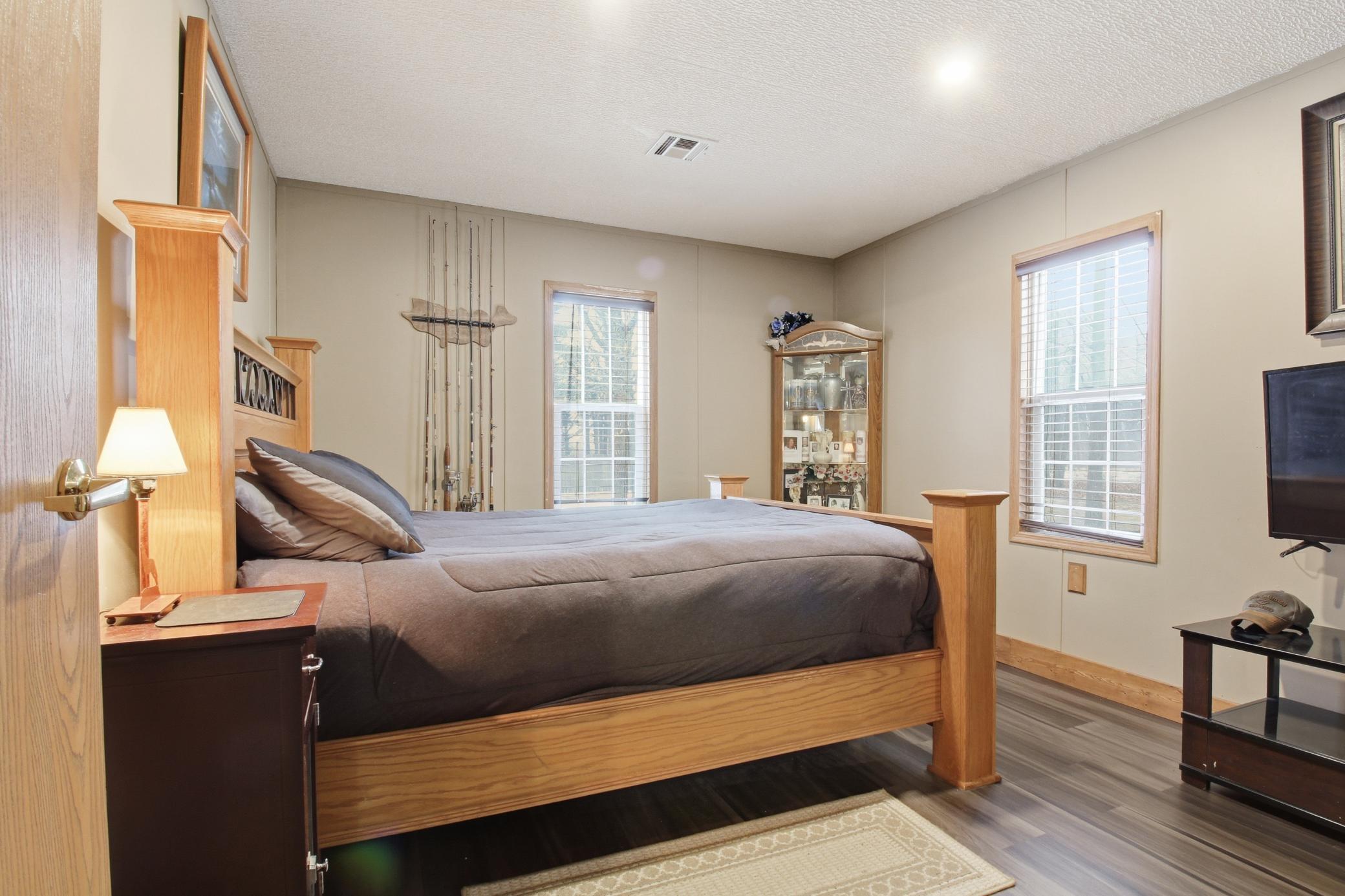 Peaceful bedroom with natural light and a comfortable layout designed for relaxation.