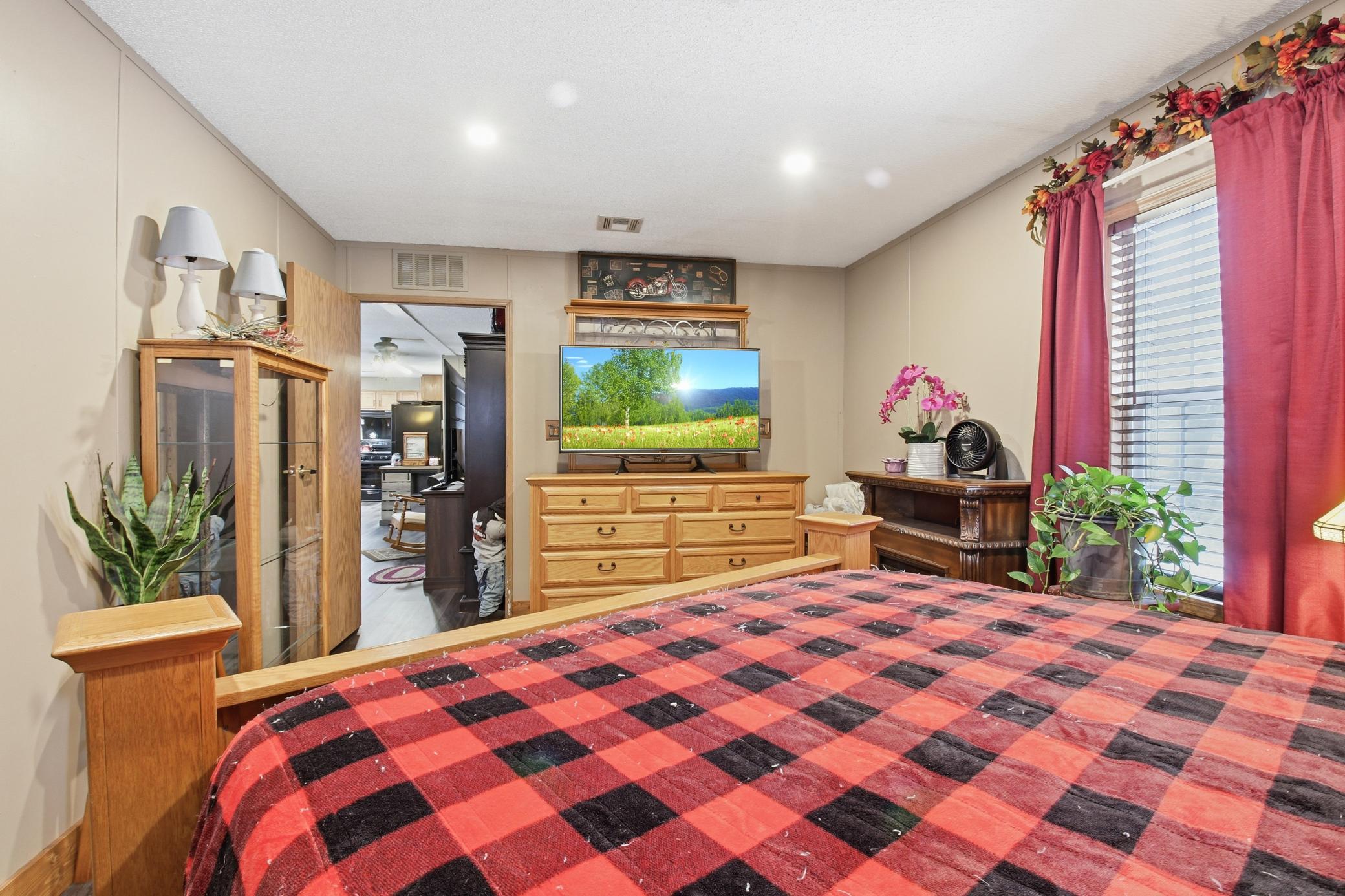 Another view of the bedroom showing plenty of storage and an easy flow back toward the main living area.”