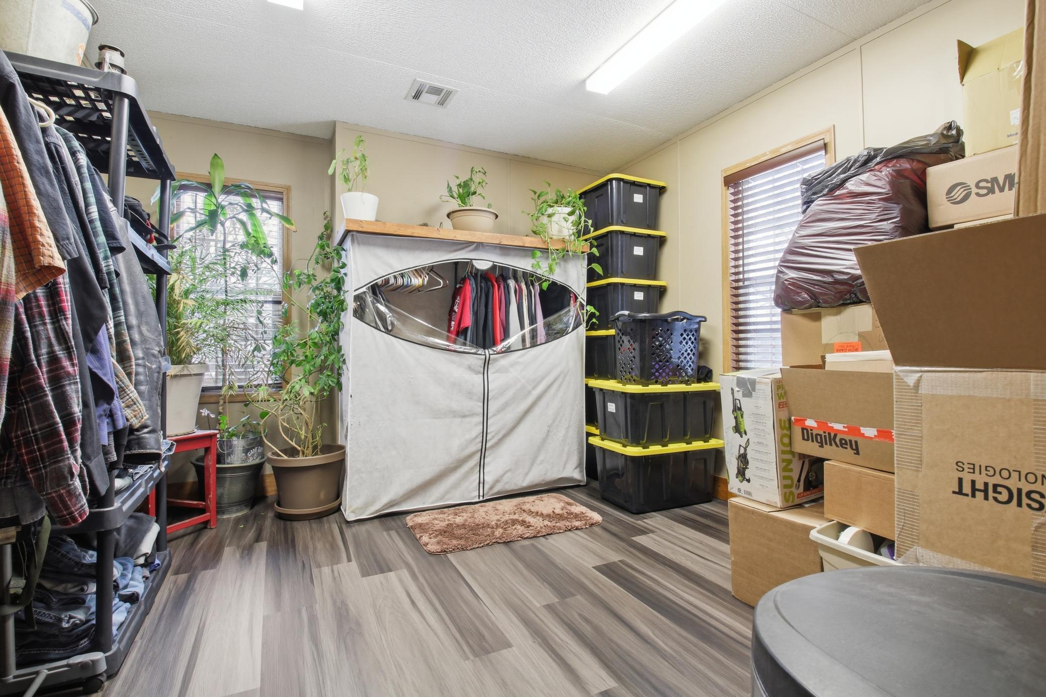 The additional bedroom is currently used for storage, offering flexible space for guests, hobbies, or a home office.